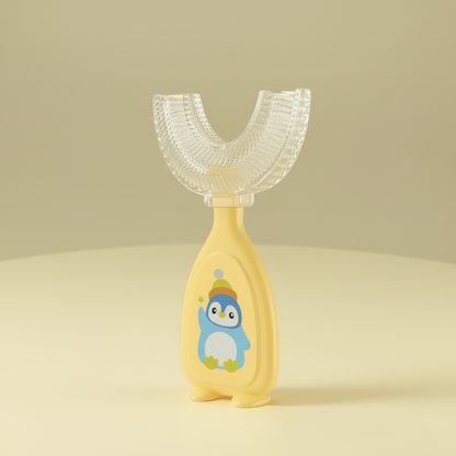 Yellow and clear children's toothbrush with a penguin design on a gray background